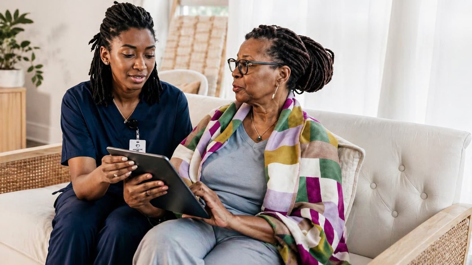 Caregiver supporting elderly woman